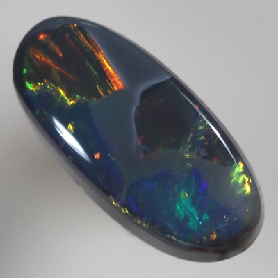 SOLID BLACK OPAL Neon bright rolling flashes, orange and green with a touch of blue